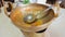 Dirty brass pan and dirt ladle after meal, brass pan can be versatile. Need to washing dirty brass pan. In this picture use it for