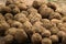 Dirty brown Irish potatoes in the market