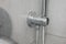Dirty calcified shower mixer tap, faucet with limescale on it, plaque from hard water, Chrome plated shower, close up