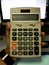 Dirty calculator in man hand