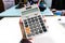 Dirty calculator in man hand