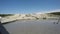 Dirty caucasian people swimming in crater of mud volcano Shugo