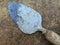 Dirty cement spoon with hardened cement residue