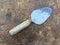 Dirty cement spoon with hardened cement residue