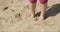 Dirty child feet on sand