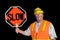 Dirty construction worker holding slow sign