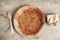 Dirty from food disposable paper utensils on a wooden background. Wooden fork and paper cup with plate on wooden background. Eco