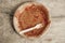 Dirty from food disposable paper utensils on a wooden background. Wooden fork and paper plate on wooden background. Eco friendly