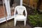 Dirty garden plastic chairs ready for cleaning. Home improvements and renovations. Plastic objects in the garden. Old and used gar