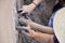 Dirty hand while building mud house.