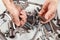 Dirty hand of worker with tools for repairing machines in workshop