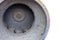 Dirty impeller of a low pressure centrifugal fan in a large supply and exhaust system, the foreground and background are blurred w