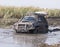 Dirty jeep stuck in a swamp