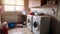 Dirty Laundry Room Transformation: Before Renovation, Two Large Washing Machines