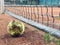 Dirty lonely tennis ball by the net at clay tennis court. After practice. Close up. forgotten ball