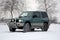 Dirty Mitsubishi Pajero in the snow