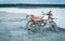 Dirty motorcycle in sand