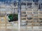 Dirty old eroded cracked plaster cement block fence. Concrete block wall. Destroyed crumbling cement mortar texture. Background of