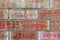 dirty old weathered red vintage worm brick wall stained retro style surface aged bricks closeup moldy