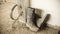 A dirty pair of rubber boots full of dried concrete lies on the unfinished floor of a building under construction