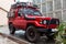 Dirty red jeep in rainy day