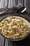 Dirty rice is a classic Cajun dish that is typically made with chicken livers and ground meat close-up in a plate. Vertical