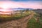 Dirty road in carpathian foggy alpine valley