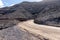 Dirty road leading to Cofete beach in Fuerteventura. Canary Islands