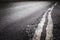 Dirty rough asphalt road surface, textured grunge transport, grey grainy traffic highway transportation way closeup