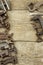 Dirty set of hand tools on a wooden background. Old rusty tools. Equipment for locksmith and metalworking shop.