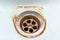 Dirty sink drain mesh, hole with limescale or lime scale and rust on it close up, dirty rusty bathroom washbowl