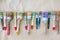 Dirty used artist`s brushes lie in a row or line. Background bei