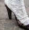 Dirty white high-heel shoe