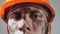 Dirty Worker Looking at Camera. Beautiful Caucasian Man in a Hard Hat. Physical labor. Coal mining. People Working Equipment