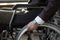 Disability businessman with wheelchair against business office