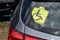 Disability icon on rear window of car. Identification symbol confirming right of disabled car owners to benefits