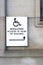 Disabled accessible push button buzzer for assistance sign at building entrance