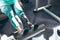 Disabled active senior woman exercising with leg press machine in fitness studio