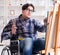 Disabled artist painting picture in studio