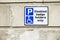 Disabled Badge Holders Only at Car Park Sign on Wall