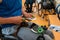 a disabled basketball player puts on a corset and bandages on his arms and fingers in preparation for a game in the