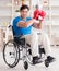 Disabled boxer at wheelchair recovering from injury