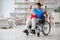 The disabled boxer at wheelchair recovering from injury