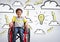 Disabled boy in wheelchair with light bulb in clouds