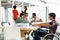 Disabled businessman using laptop in the conference room