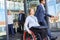 Disabled businesswoman in wheelchair after meeting