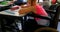 Disabled Caucasian schoolgirl studying at desk in classroom at school 4k