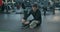 Disabled Caucasian young man athlete tying shoe laces