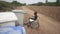 Disabled girl in wheel chair in everyday life doing recycling