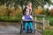 Disabled girl in a wheelchair relaxing outside